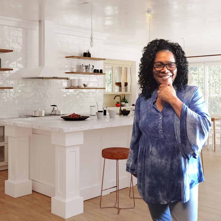 Adrienne Hernandez, the baker behind Dree Baked This, smiling in a bright kitchen